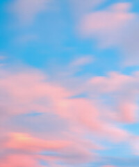 Obraz premium Romantic blue sky background with soft clouds blur motion effect.