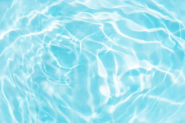 Blue water with ripples on the surface. Defocus blurred transparent blue colored clear calm water...
