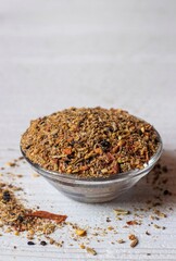 Condiment or Spices Powder Mixture in a Glass Bowl Isolated on White Background