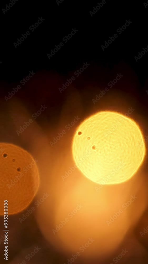 Poster abstract colorful golden circles falling down slowly on black background, seamless loop. animation. 