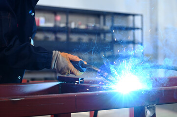 welder who joins metal parts together by welding