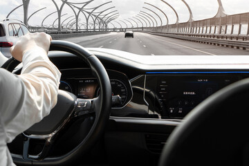 Inside the taxi. A male driver drives at speed through the streets of the city. Taxi driver man...