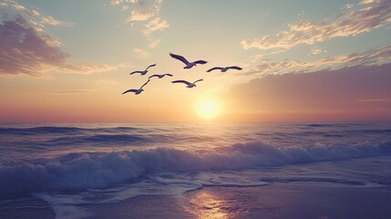 Naklejka premium A group of pelicans flying in formation above the ocean waves during sunset.