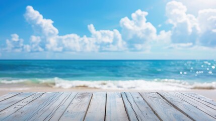 Fototapeta premium White wooden table on blurred blue sea and sky background for summer vacation display