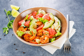 Fresh shrimp salad with avocado and grapefruit. Healthy diet, vegetarian lifestyle, and nutrition concepts