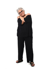 front view of a senior woman standing  and hands on shoulders on white background