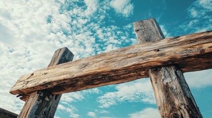 A weathered wooden beam against a cloudy sky. Perfect for a rustic, outdoor theme.