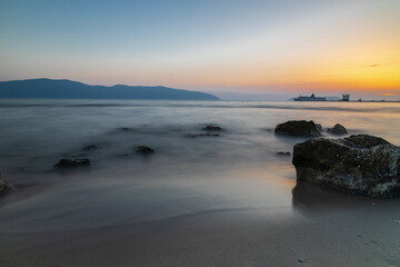 Sunset at beach near the city of Vlor&euml; in Albania, which sprawls on the Bay of Vlor&euml; and is surrounded by the foothills of the Ceraunian Mountains along the Albanian Adriatic and Ionian Sea Coasts