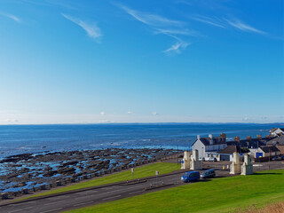 The entrance to Victoria Park via Kings Road in the Coastal Town of Arbroath with its distinctive Pillars and Old Fishermans Cottages nearby.