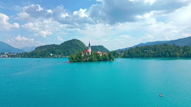 Picturesque aerial view of the Bled Lake with island with Pilgrimage Church of the Assumption of Maria. Beautiful background with lake in Julian Alps region, Slovenia. High quality footage 
