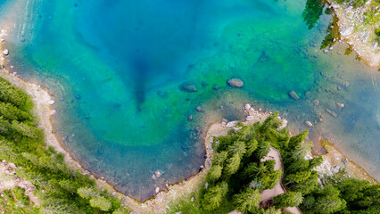 Aerial views of Lago di Carezza, the lake of 1.000 colours, in Dolomites. 