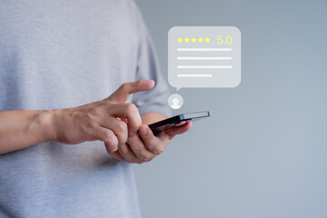 Person interacting with a smartphone, giving a five-star rating. Business service customer...