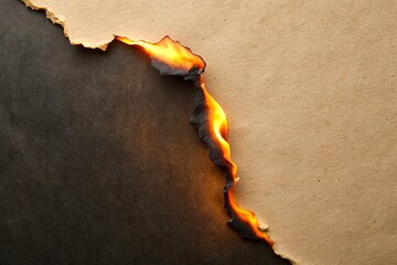 Burn black paper with fire damaged on beige background for your presentation