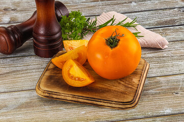 Organic juicy ripe yellow tomatoes