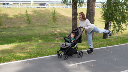 Caucasian woman roller skating with her toddler son in a stroller. 