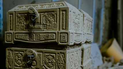 carving element. furniture in classic style. white color wood with gold trim. patina. carving. small depth of field. luxury furniture. use as background.