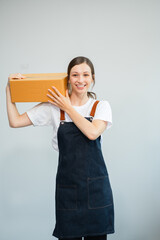 Woman holding parcels box, isolated on white background.