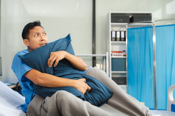 Obraz premium Patient sitting in bed, stressed, bored, loneliness, anxiety/health care and medical.
