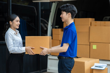 Asian delivery man deliver box parcel package to customer at home office, shipping delivery concept.