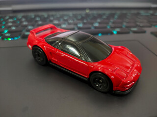 red car toy at desk background