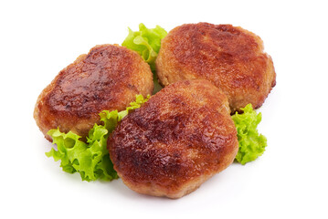 Roasted meatballs in breadcrumbs with lettuce, close-up, isolated on a white background.