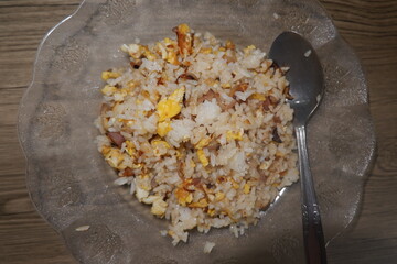 Nasi goreng dish served with fried rice, fried egg and chicken