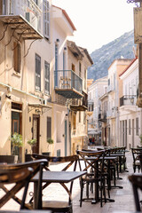 The lively café at Alley Nafplio invites visitors to relax and savor the warmth of the sun, enveloped by beautiful old architecture and vibrant street life.
