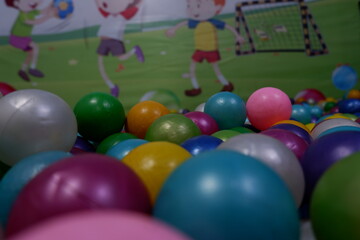 Modern kid's playground with slide and balls indoor