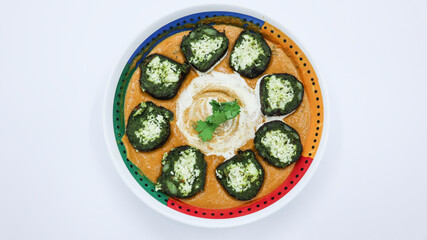 Delicious Palak Kofta with gravy served in bowl. Spinach balls stuffed with paneer or cottage cheese.