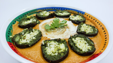 Homemade Delicious Palak Kofta with gravy served in bowl. Spinach balls stuffed with paneer or cottage cheese.