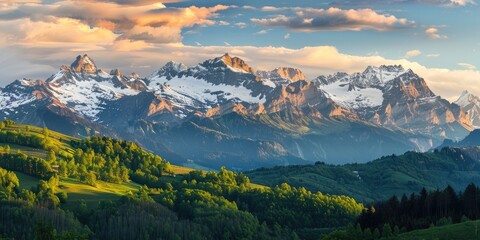 Fototapeta premium Golden Glow of Sunrise on the Peaks of the Swiss Alps with Spring Greenery