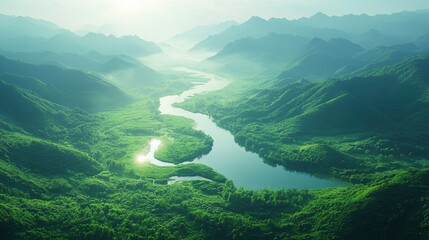 Fototapeta premium As dawn breaks, mist blankets the tranquil landscape of green mountains in China. Winding rivers flow gracefully at their feet, illuminated by soft sunlight.