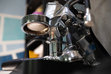 This series of close-up images showcases the intricate details of a professional espresso machine, capturing the essence of a barista's craft. 