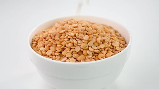 Filling toor dal in a white bowl.