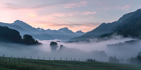 Early Morning Mist Over the Swiss Alps at Sunrise in Summer