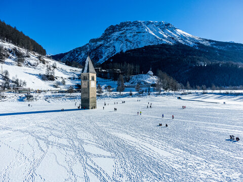 View from above of the ancient bell tower of Curon Venosta on Lake Resia