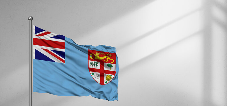 Fiji national flag cloth fabric waving on beautiful window light grey Background.