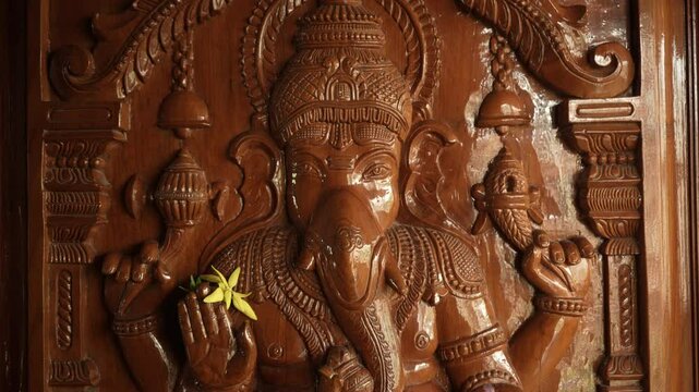 Tripod shot of a door with god ganesh sculpture