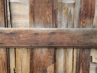 Fototapeta premium Old wooden fence boards close up. Wooden background. Fence construction