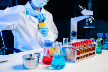 Fototapeta premium Biologist taking experiment with plants working in laboratory..
