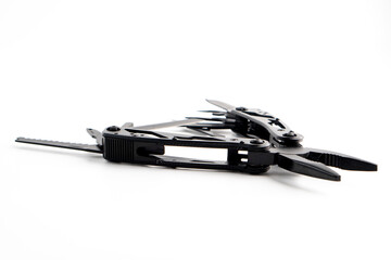 Obraz premium Compact portable black multitool isolated on white background. The Knife multi-tool