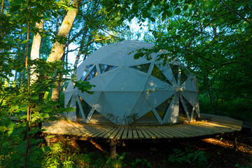 Glamping Domes in campsite in forest. Geodesic Dome House. Glamping Home for relax and yoga. Camping in Glamping park. FDomes geodesic, geodome tent in nature. Luxury Dome tent in camping. Adventure © MaxSafaniuk