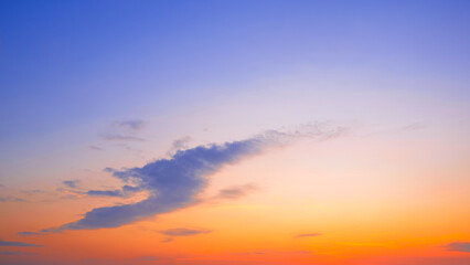 Dusk Sky Background in the Evening with Orange Light and Sunset Cloud on Blue Purple Twilight sky, Idyllic Natural Tranquil Scene