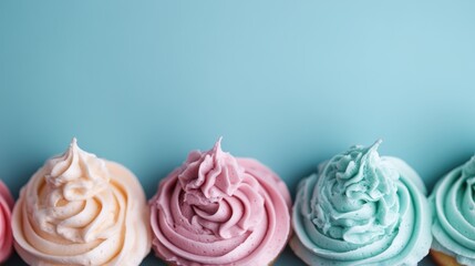 A row of vibrantly colored cupcakes against a blue background, each with beautifully swirled frosting, representing sweetness, fun, and whimsy in a bright, cheerful display.