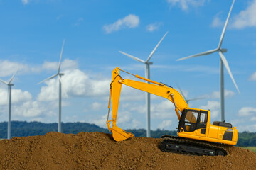 Obraz premium Crawler Excavators with are digging the soil in the construction site on the blue sky backgrounds