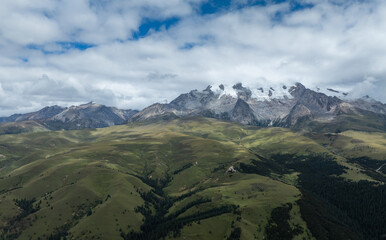 High altitude grassland and snow capped mountain in Sichuan, China