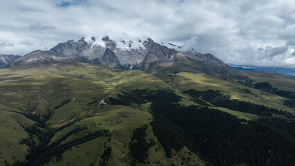 High altitude grassland and snow capped mountain in Sichuan, China