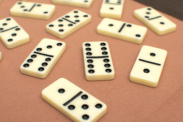 Dominoes bones on brown background	