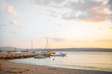 Beautiful sunset over the harbor in Croatia. Boat pier in the Adriatic Sea, Crikvenica