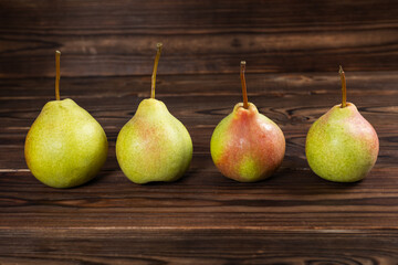 fresh pears on wooden background
